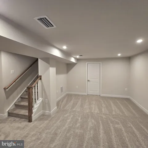 a view of an empty room with stairs