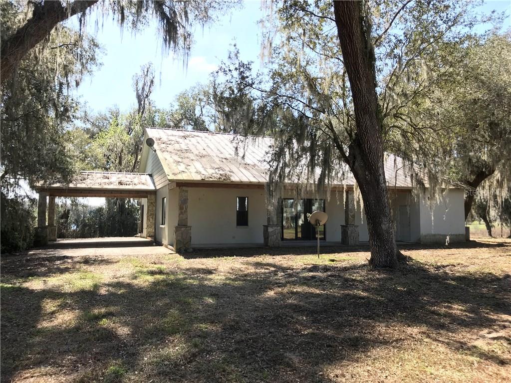 34570 Clayton Road Dade City, FL 33523 - Photo 1 of 1 a view of a house with a yard