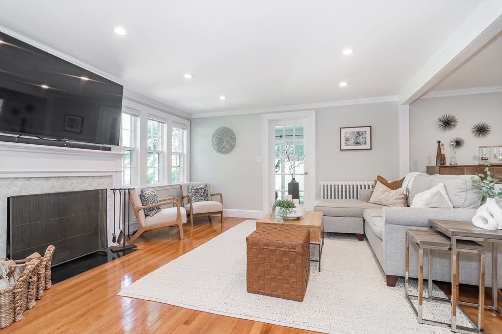 28 Cunningham Road Wellesley, MA 02481 - Photo 2 of 18 a living room with furniture fireplace and flat screen tv