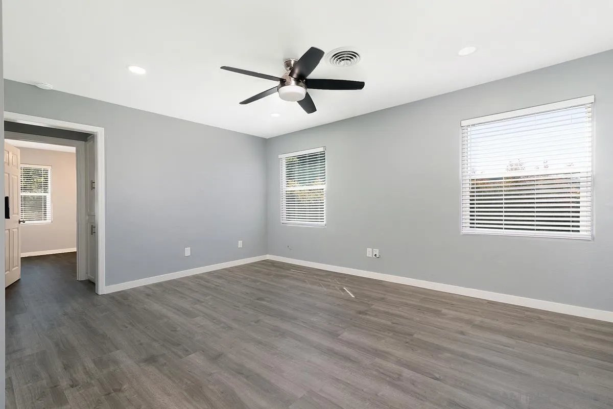 6357 Streamview Drive San Diego, CA 92115 - Photo 3 of 13 a view of an empty room with wooden floor and a window
