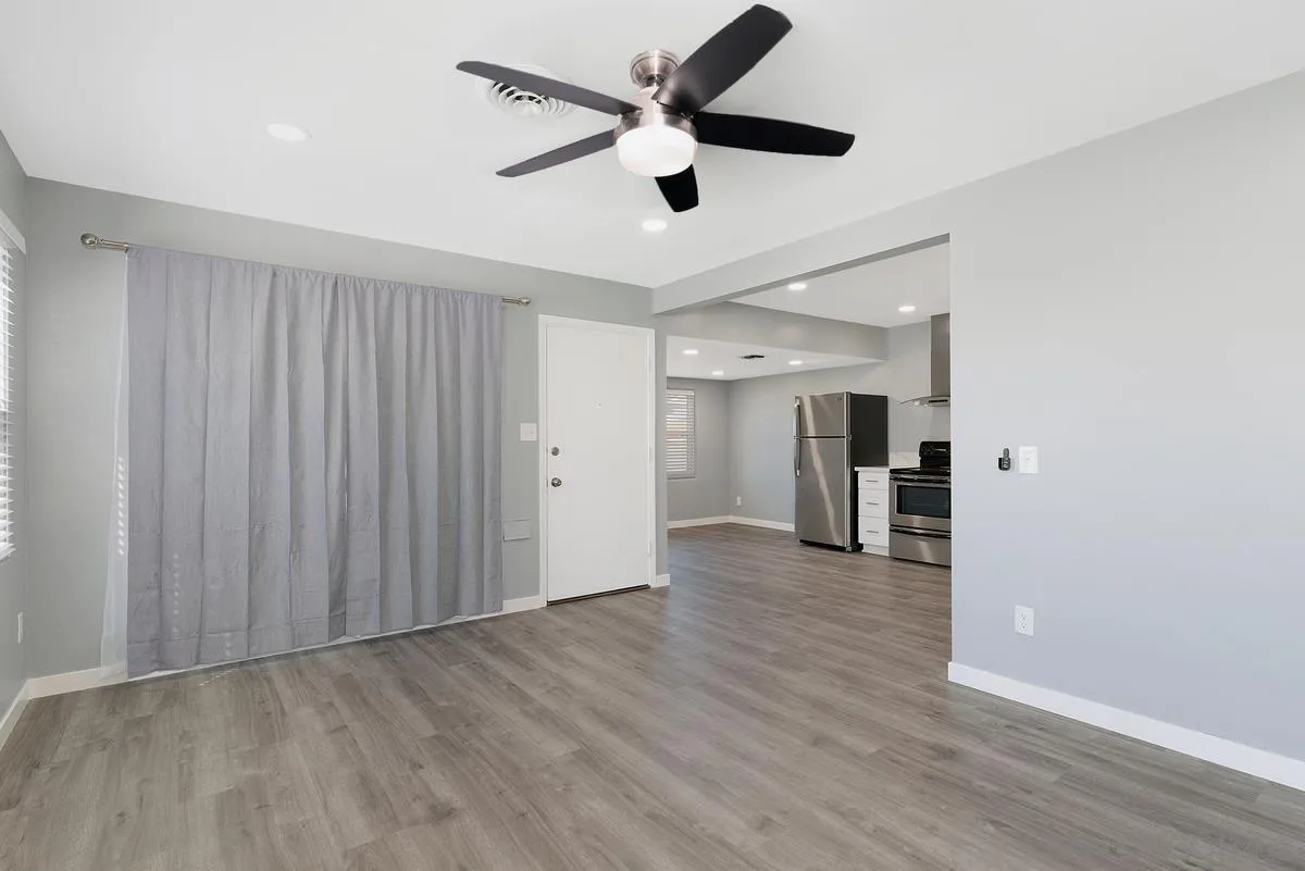 6357 Streamview Drive San Diego, CA 92115 - Photo 4 of 13 a view of empty room with wooden floor