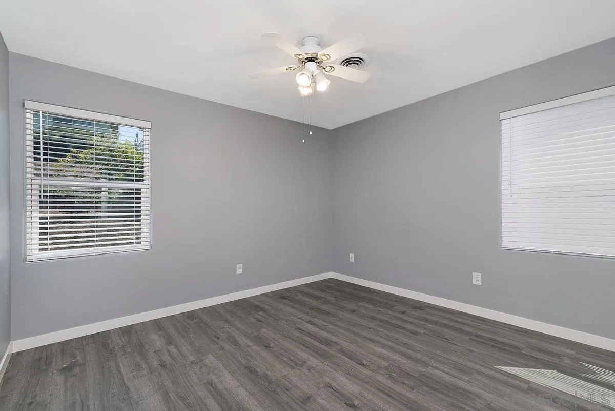 6357 Streamview Drive San Diego, CA 92115 - Photo 7 of 13 wooden floor in an empty room with a window