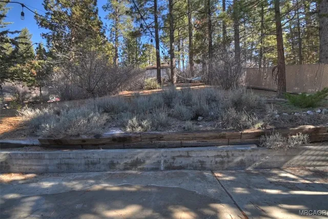 a view of a pathway of a house with a yard