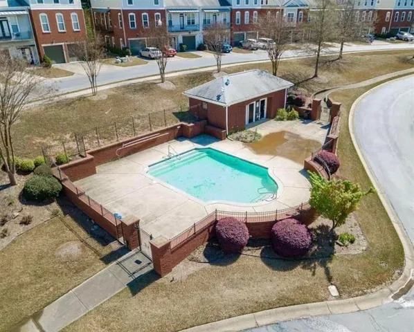 a living room with chairs and a table