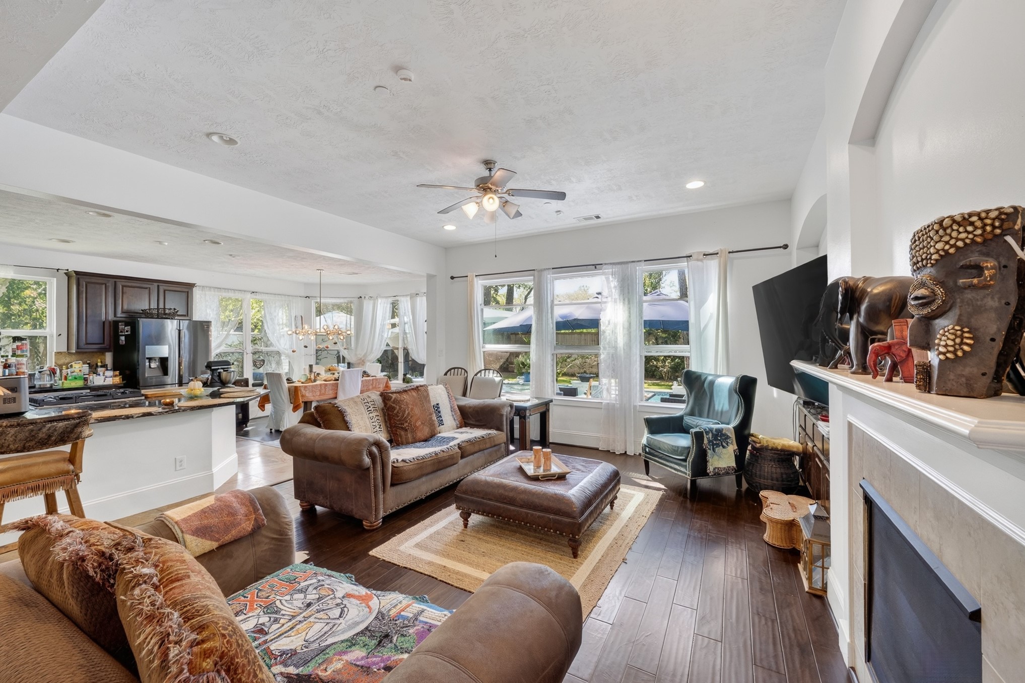 335 Voss Road Houston, TX 77024 - Photo 13 of 50 Expansive gathering room filled with natural light and timeless finishes.