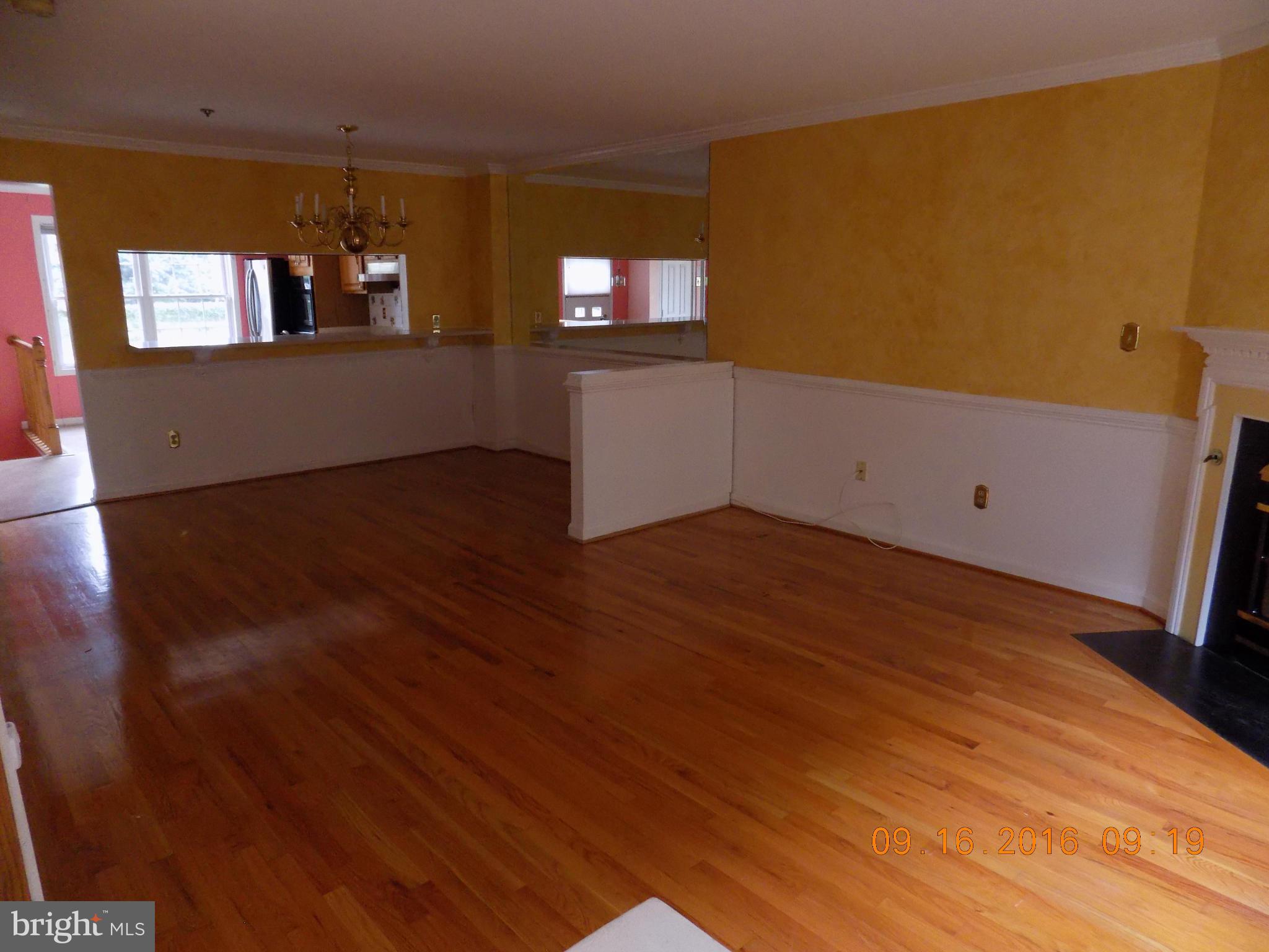 3038 South Glebe Road Arlington, VA 22206 - Photo 2 of 26 wooden floor in an empty room with a window