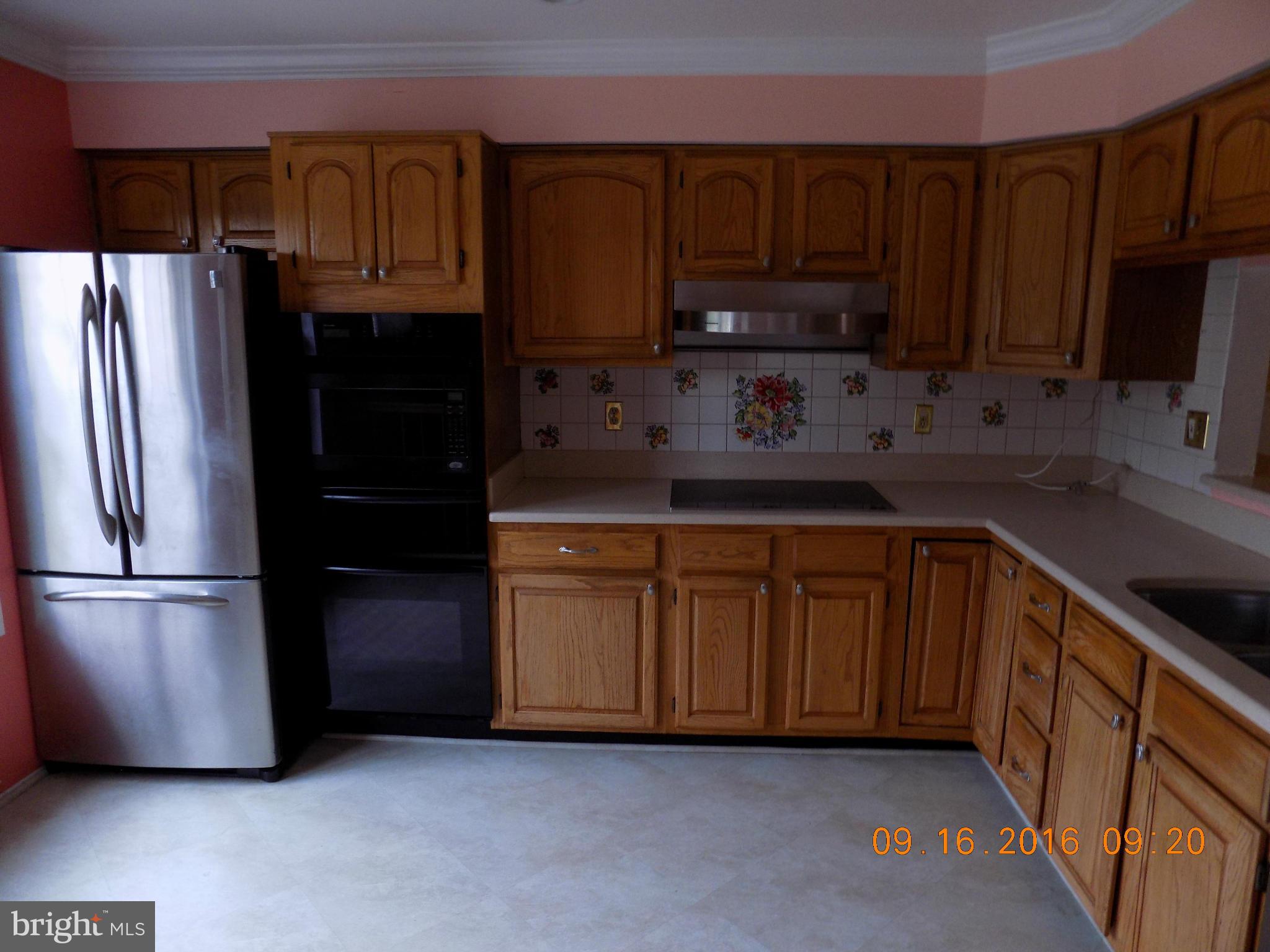 3038 South Glebe Road Arlington, VA 22206 - Photo 4 of 26 a kitchen with stainless steel appliances granite countertop a refrigerator a stove a sink and a cabinets