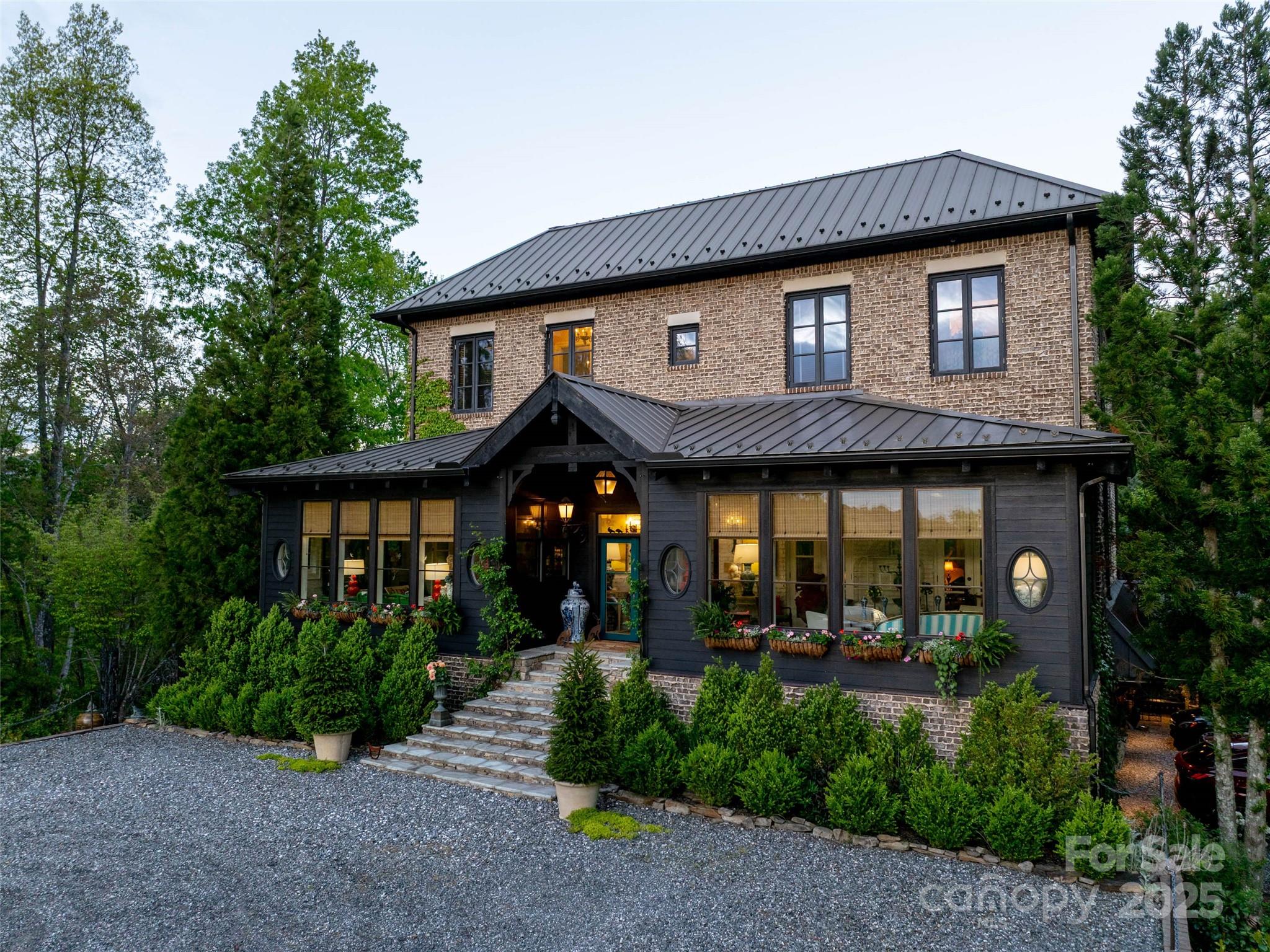 a front view of a house with garden