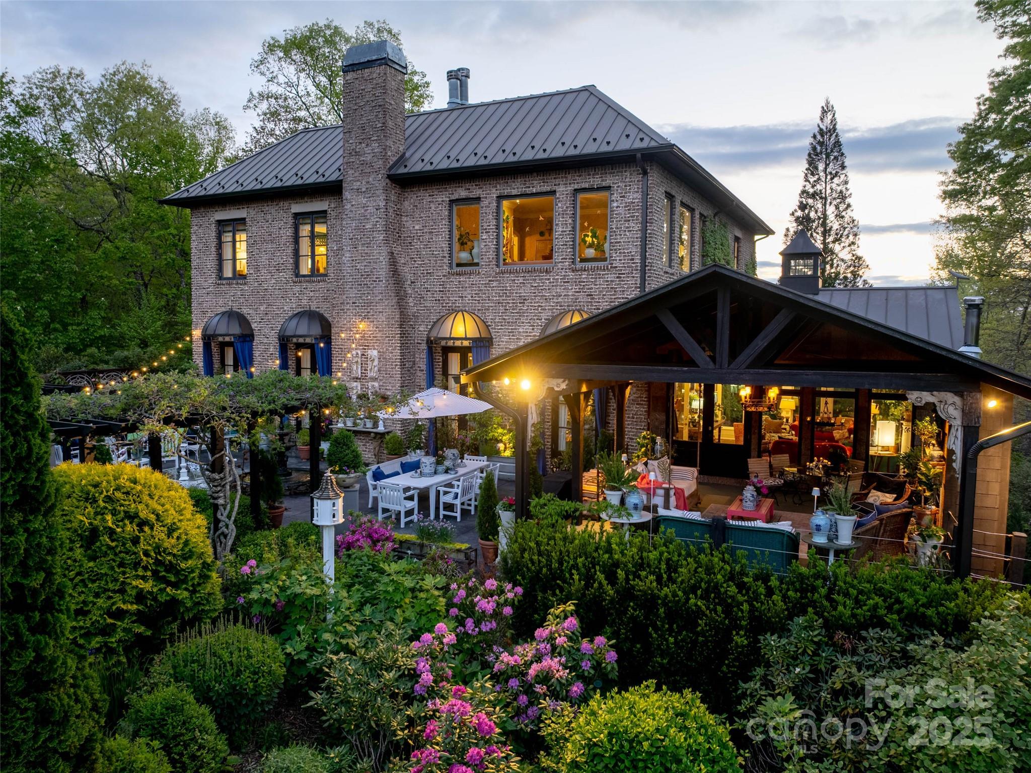 13084 Canada Road Tuckasegee, NC 28783 - Photo 11 of 48 a view of a chairs and tables in the patio