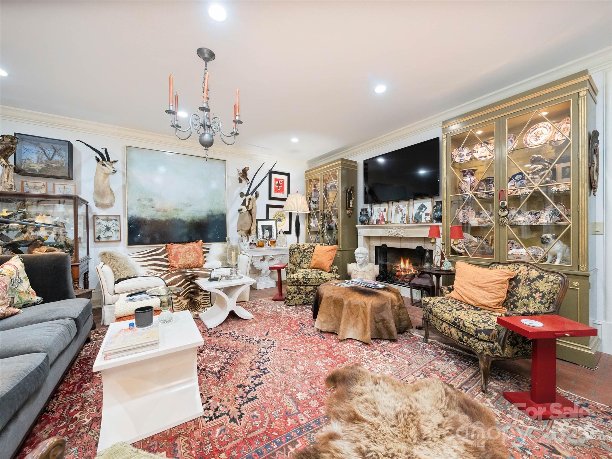 13084 Canada Road Tuckasegee, NC 28783 - Photo 12 of 48 a living room with fireplace furniture and a flat screen tv