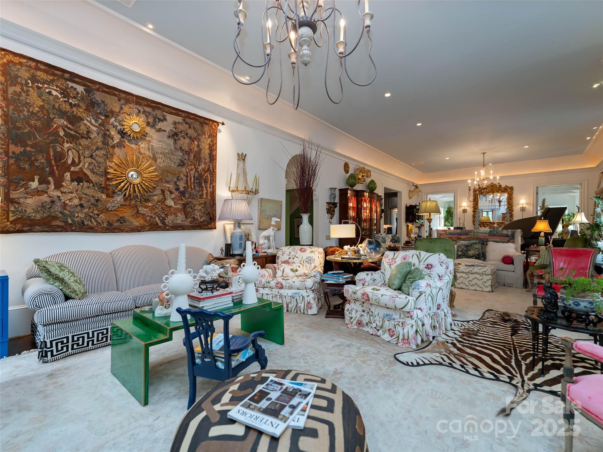 13084 Canada Road Tuckasegee, NC 28783 - Photo 22 of 48 a living room with furniture and a chandelier