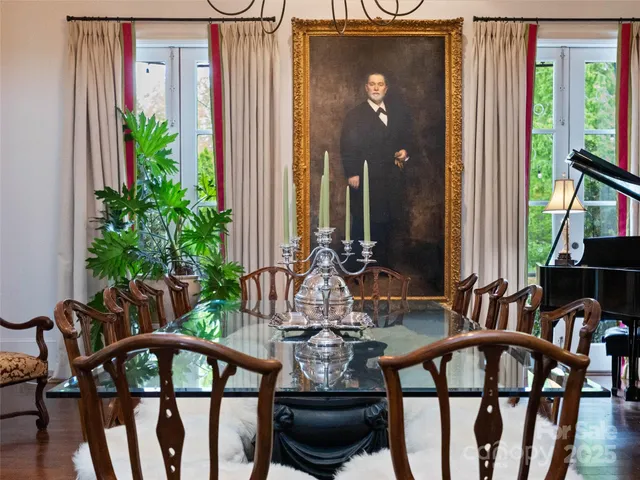 a kitchen with stainless steel appliances kitchen island granite countertop a stove and cabinets