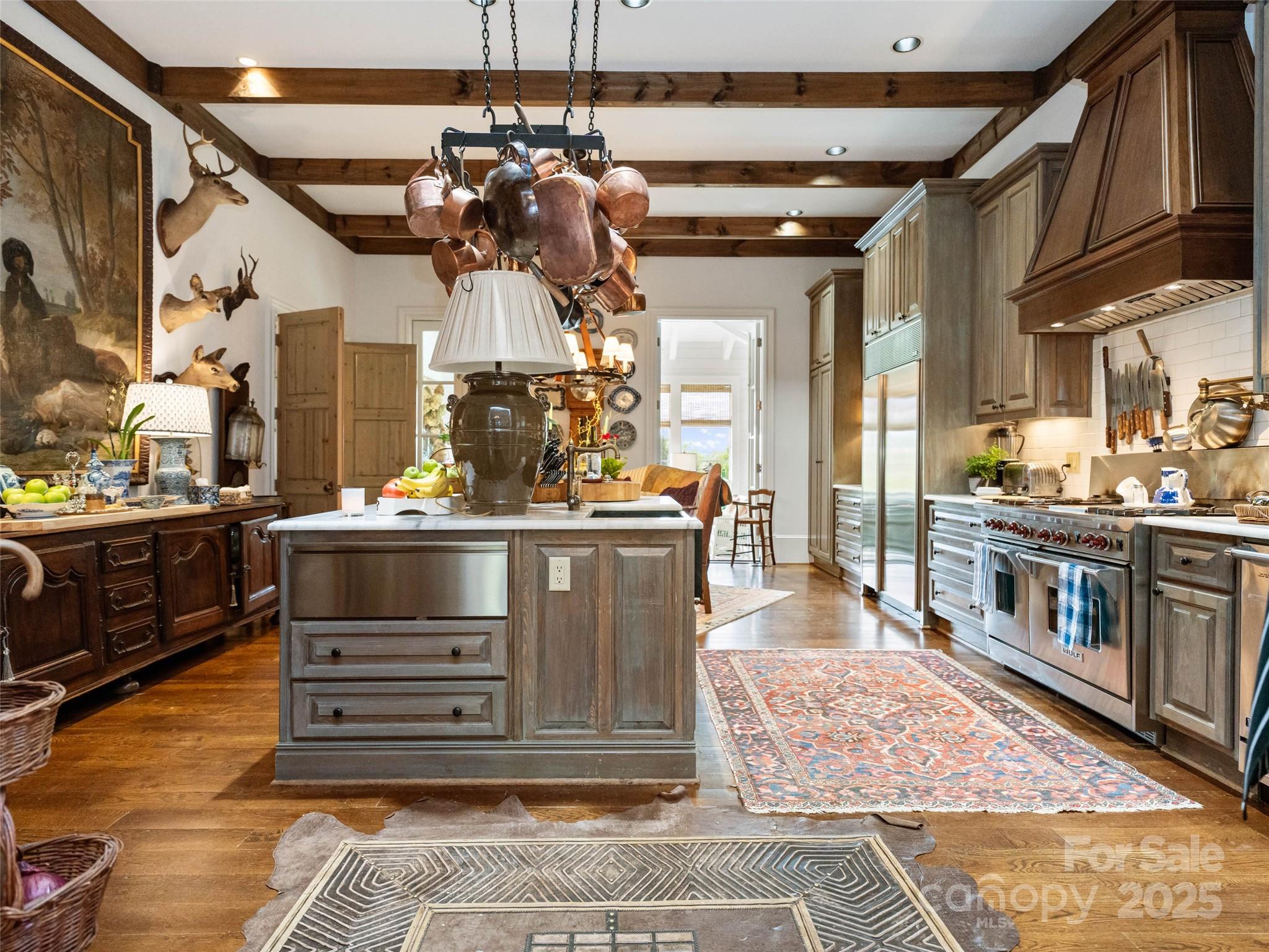 13084 Canada Road Tuckasegee, NC 28783 - Photo 25 of 48 a kitchen with stainless steel appliances kitchen island granite countertop a stove and cabinets