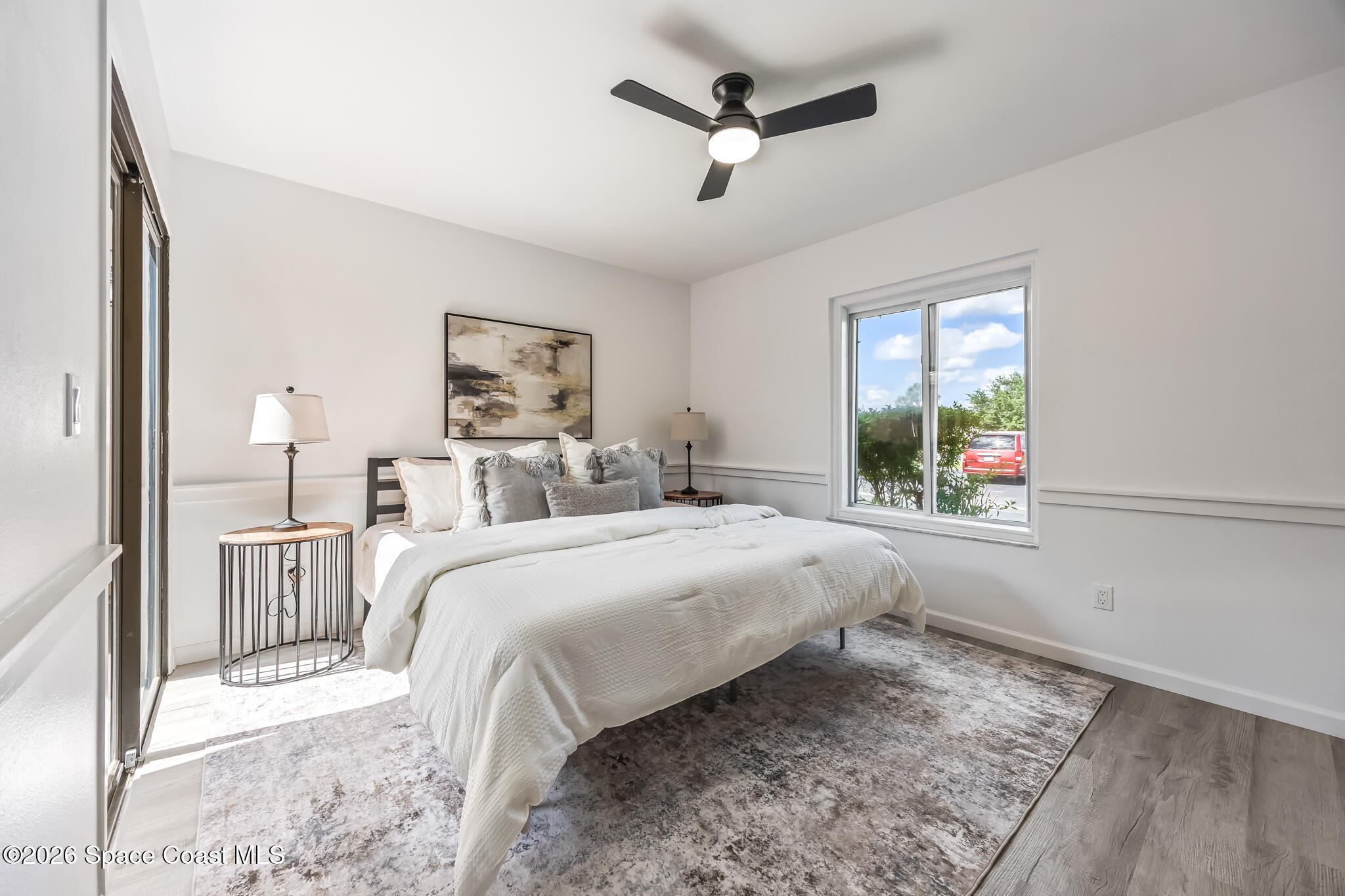 1411 Sheafe Avenue Northeast, Unit 101 Palm Bay, FL 32905 - Photo 11 of 24 a bed room with a bed and a window