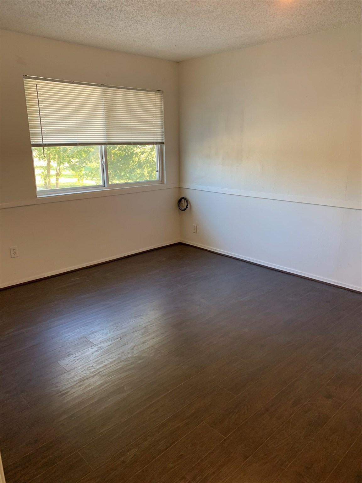 11110 Bammel North Houston Road, Unit C Houston, TX 77066 - Photo 11 of 13 Secondary bedroom #3 upstairs. Wood flooring throughout home!