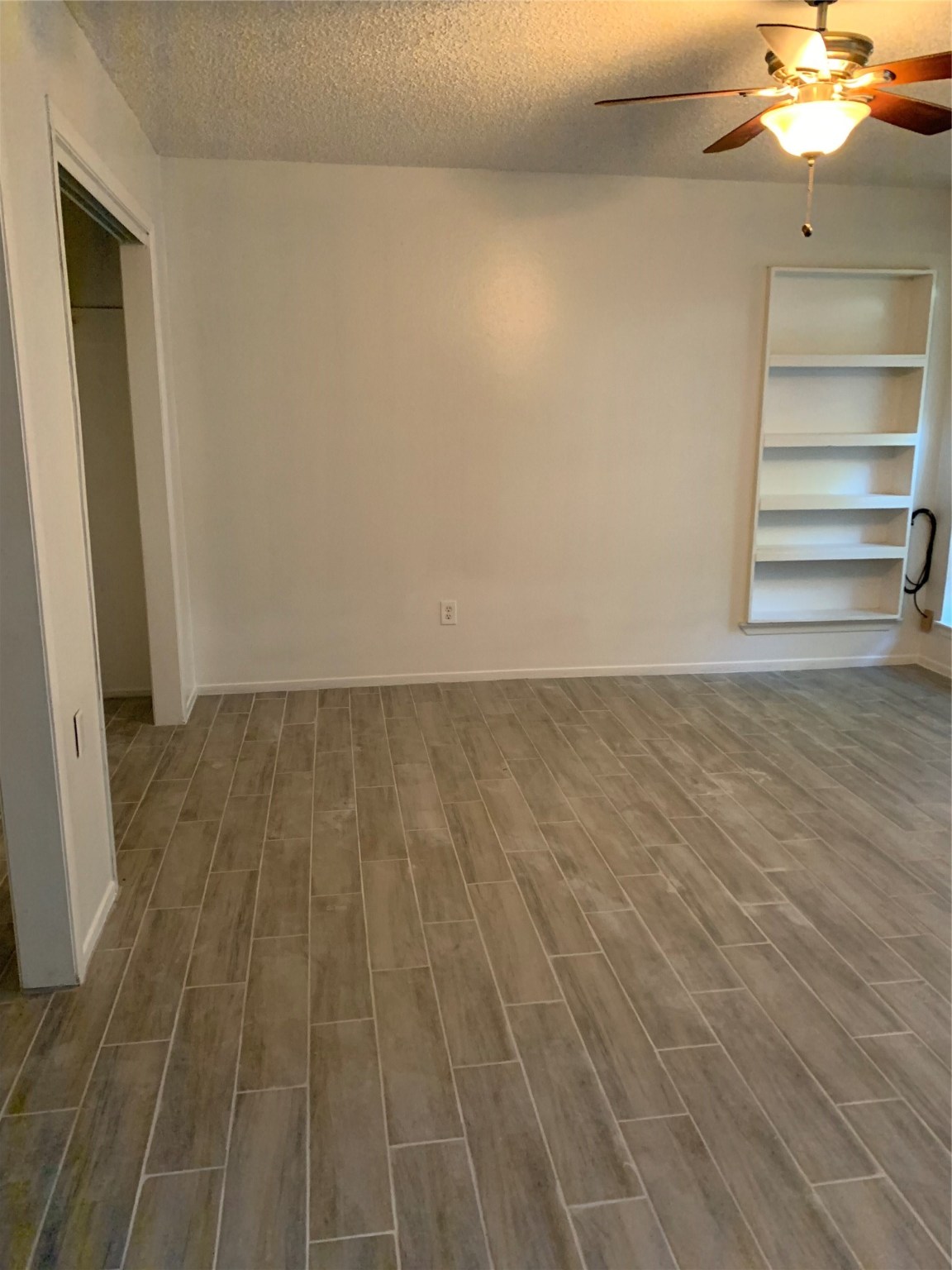 11110 Bammel North Houston Road, Unit C Houston, TX 77066 - Photo 7 of 13 Primary Bedroom with good size closet. Wood flooring throughout home!