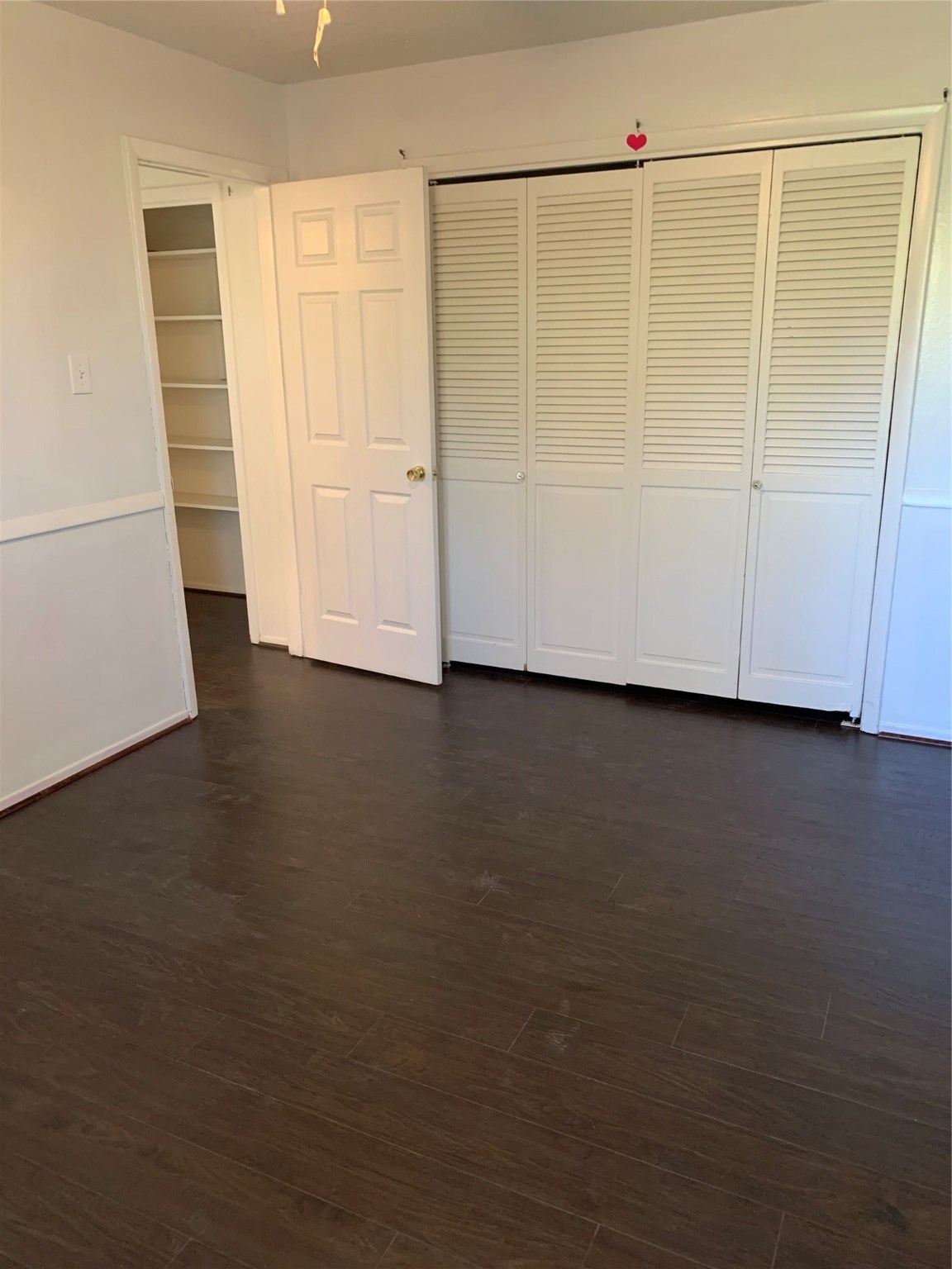 11110 Bammel North Houston Road, Unit C Houston, TX 77066 - Photo 10 of 13 Secondary bedroom #2 additional view upstairs. Wood flooring throughout home!