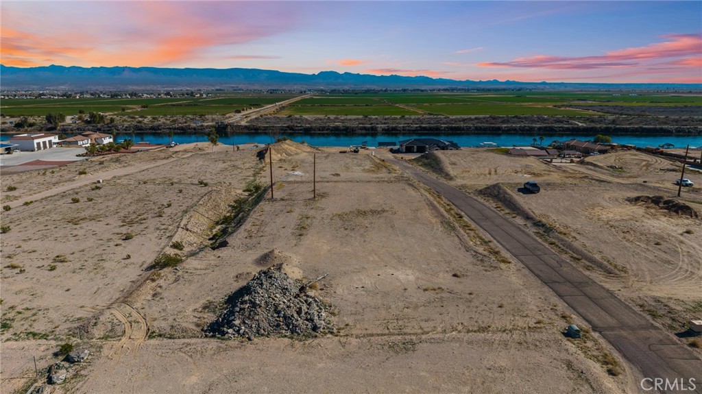 1791 River Street Needles, CA 92363 - Photo 24 of 32 a view of a lake with beach and mountain in the back