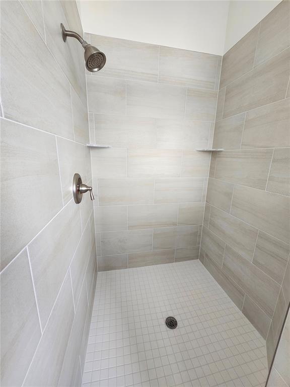 4694 Prairie Point Boulevard Kissimmee, FL 34746 - Photo 11 of 23 a bathroom with a shower