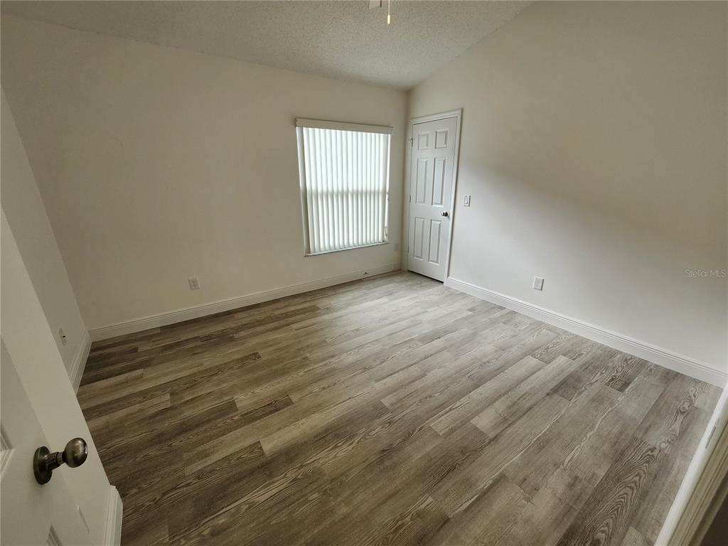 4694 Prairie Point Boulevard Kissimmee, FL 34746 - Photo 15 of 23 an empty room with windows