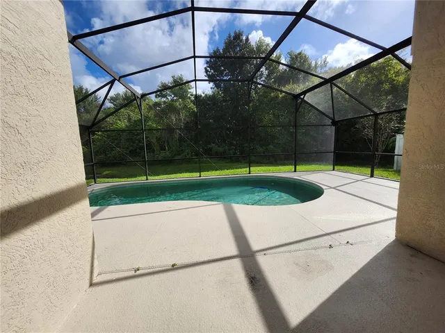 a view of a swimming pool with a park