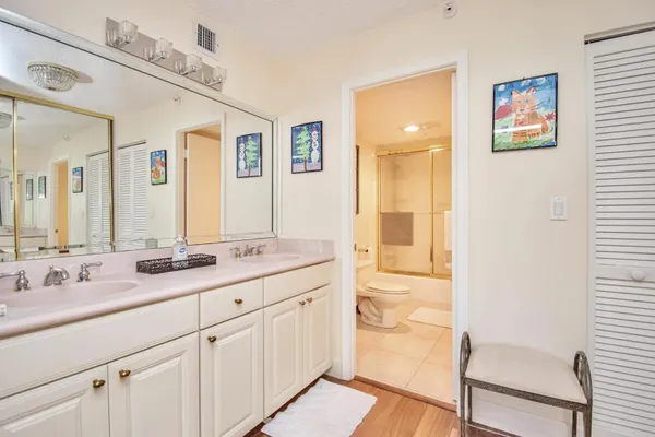a bathroom with a granite countertop sink mirror and a