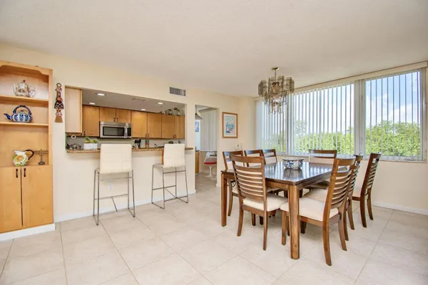 a dining room with furniture and window