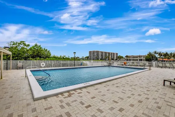 a view of swimming pool with outdoor seating