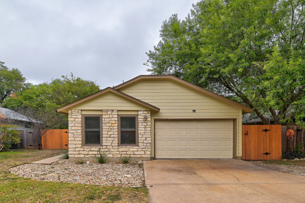 6002 Baton Rouge Drive Austin, TX 78727 - Photo 1 of 20 Single-story residence featuring a stone facade and light-toned siding