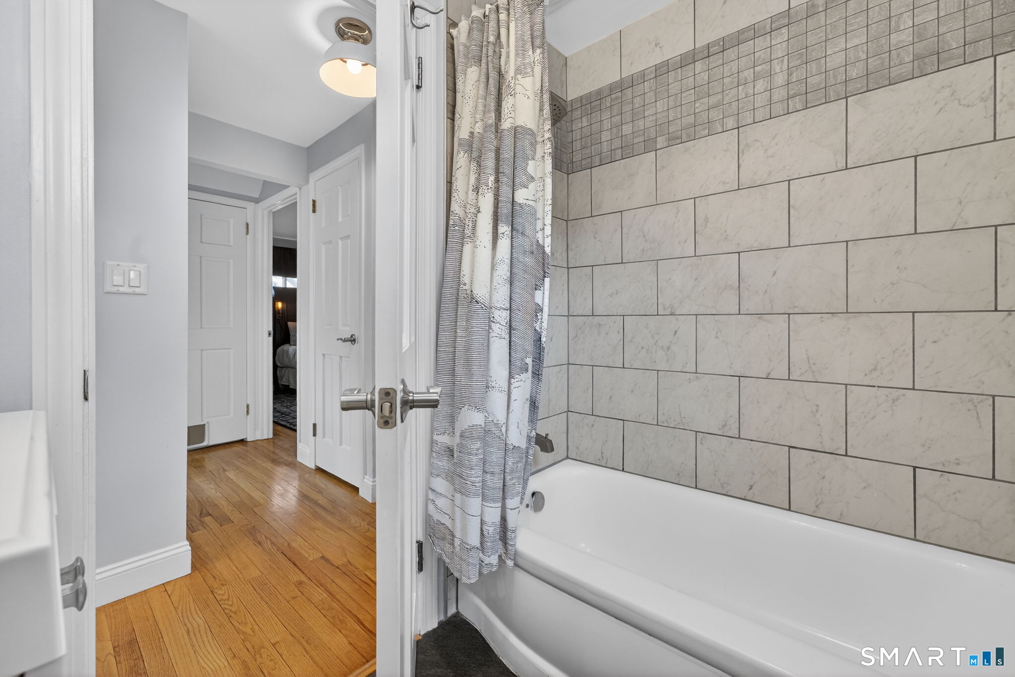 12 Lewis Street Simsbury, CT 06081 - Photo 17 of 35 a bathroom with a bathtub and a shower