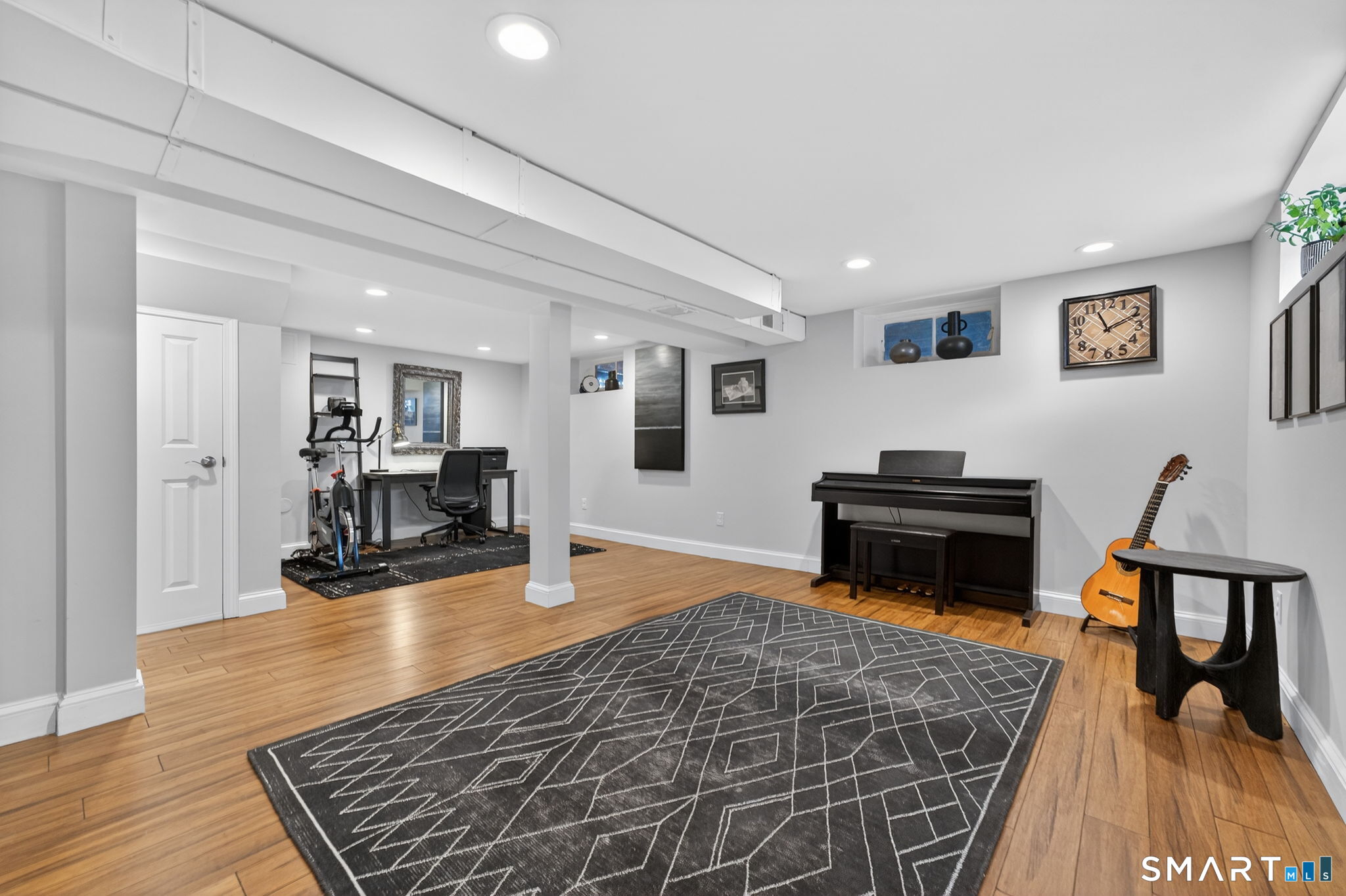12 Lewis Street Simsbury, CT 06081 - Photo 24 of 35 a living room with furniture and a wooden floor