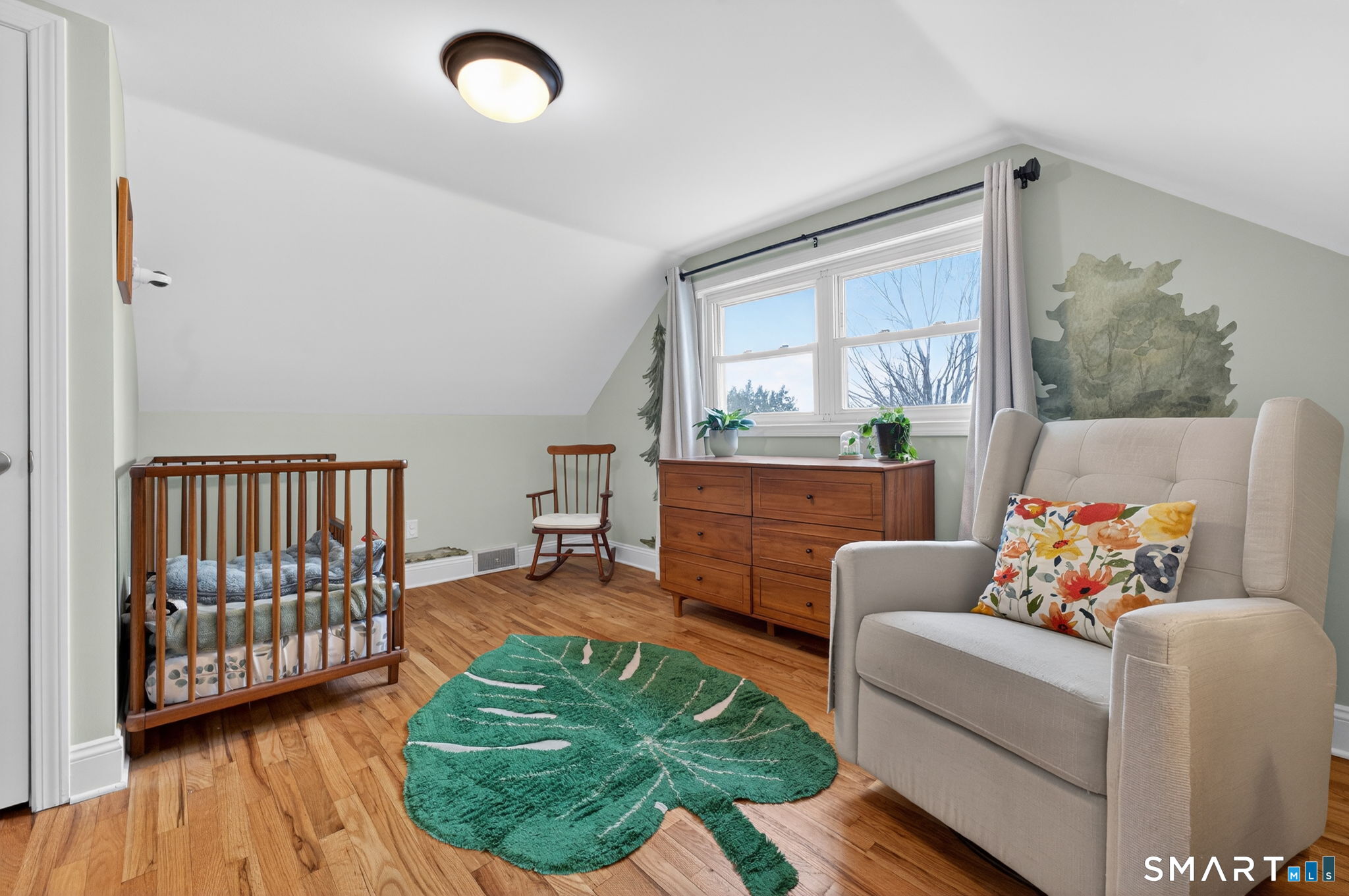 12 Lewis Street Simsbury, CT 06081 - Photo 26 of 35 a living room with furniture and a window