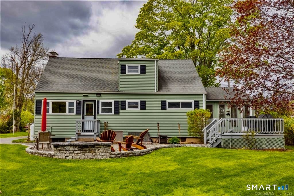 12 Lewis Street Simsbury, CT 06081 - Photo 31 of 35 a view of a house with a yard porch and sitting area