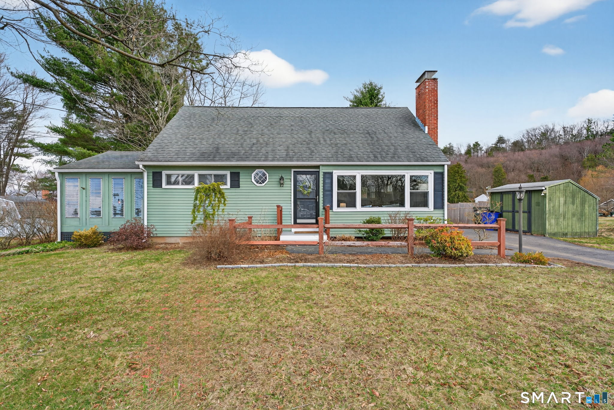 12 Lewis Street Simsbury, CT 06081 - Photo 32 of 35 a view of a house with a yard patio and fire pit
