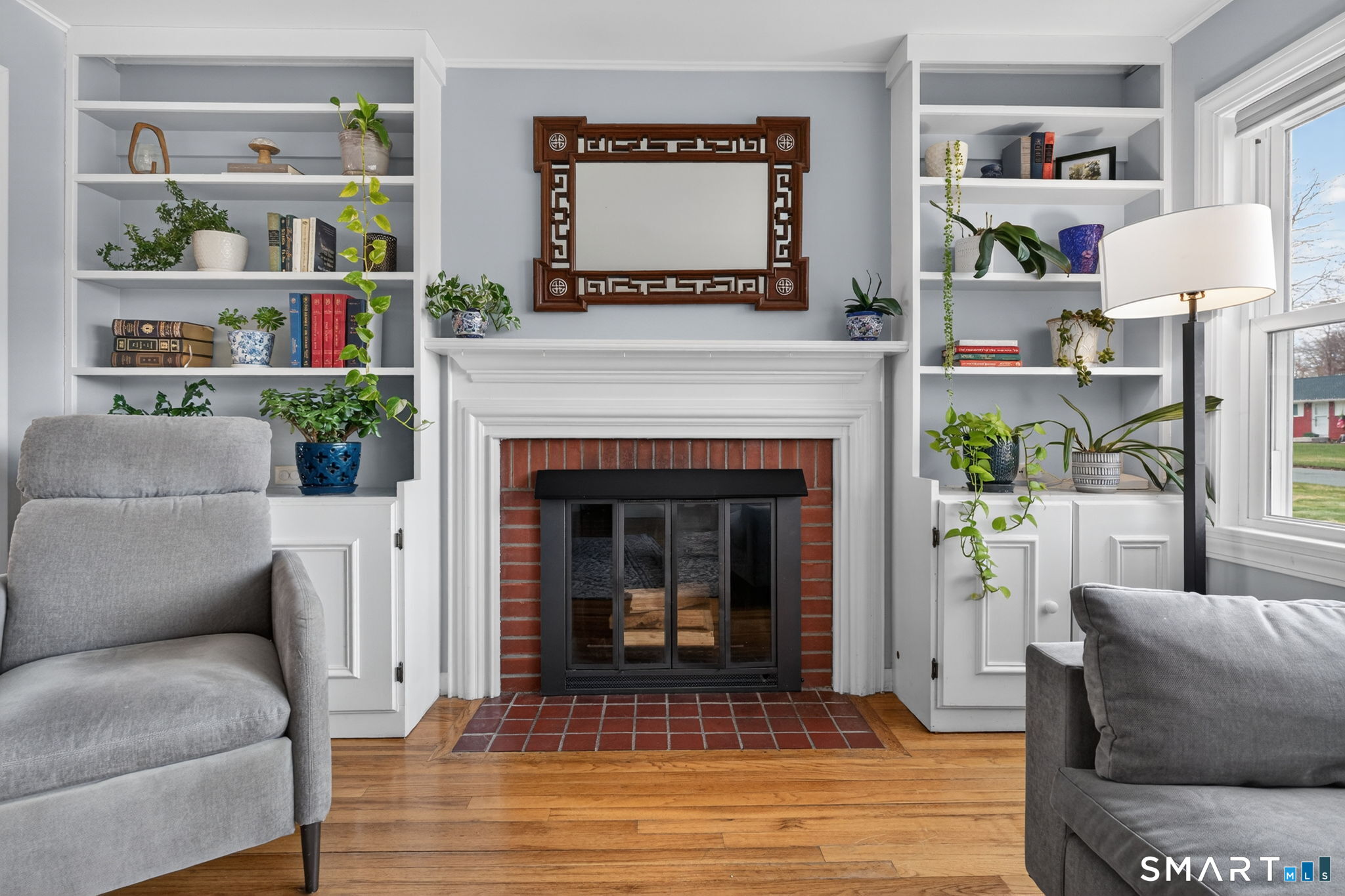 12 Lewis Street Simsbury, CT 06081 - Photo 5 of 35 a living room with furniture and a fireplace