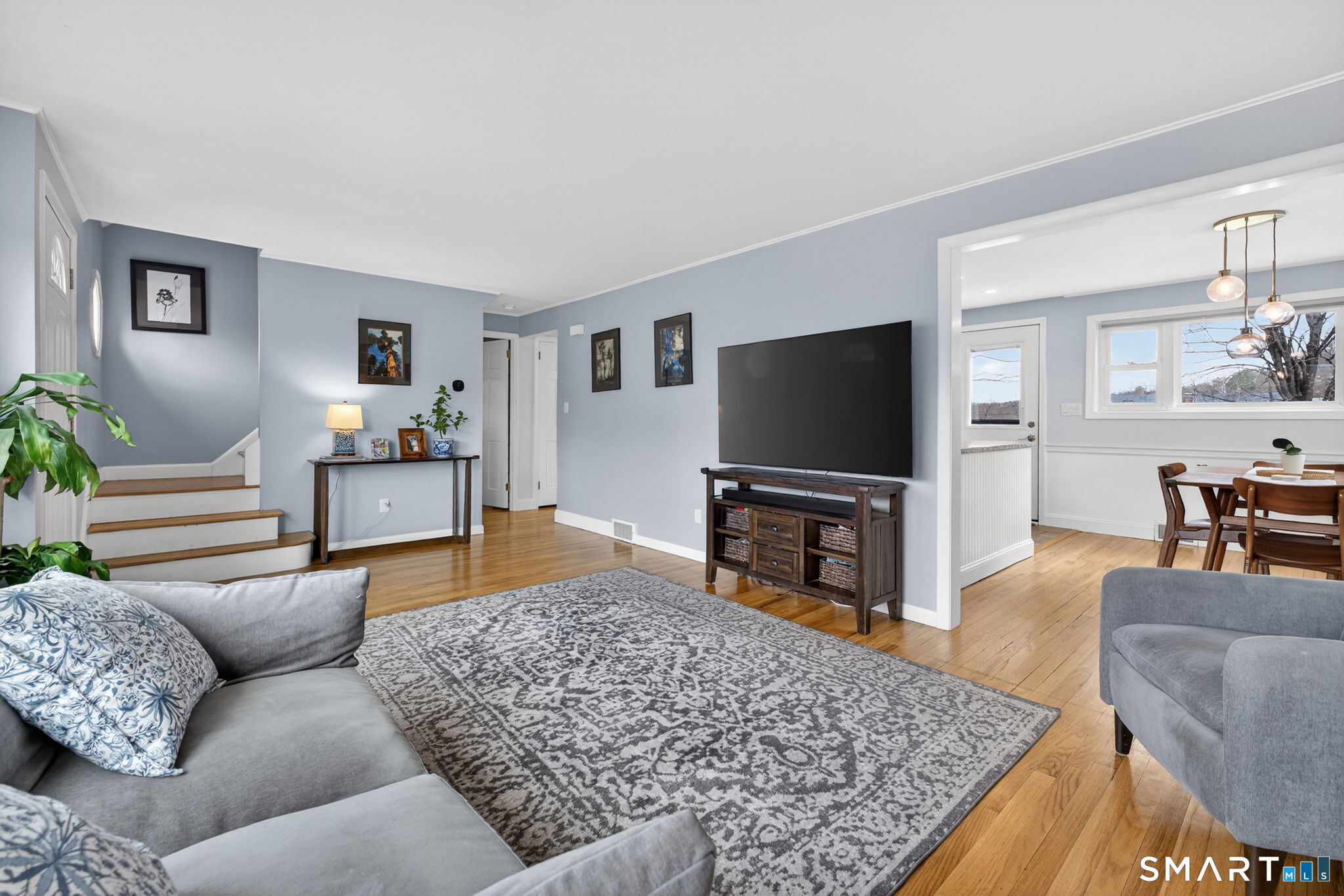 12 Lewis Street Simsbury, CT 06081 - Photo 6 of 35 a living room with furniture and a flat screen tv