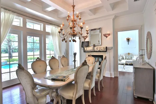 a dining room with furniture and window