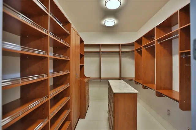 a view of a hallway with wooden floor and stairs
