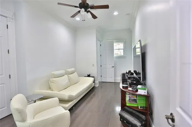 a bathroom with a granite countertop sink mirror vanity and toilet