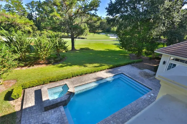 a view of a house with yard and tree s