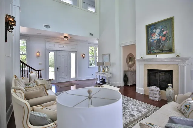 a living room with furniture and a fireplace