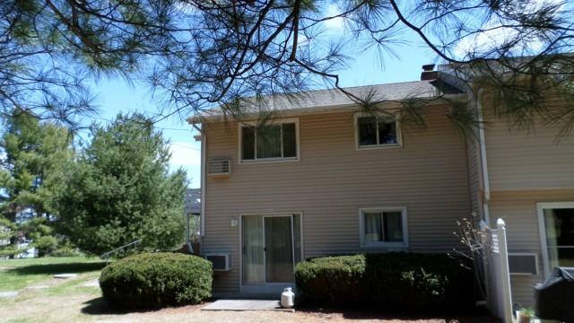 468 Danbury Road, Unit 1 New Milford, CT 06776 - Photo 1 of 1 a view of a house with a yard