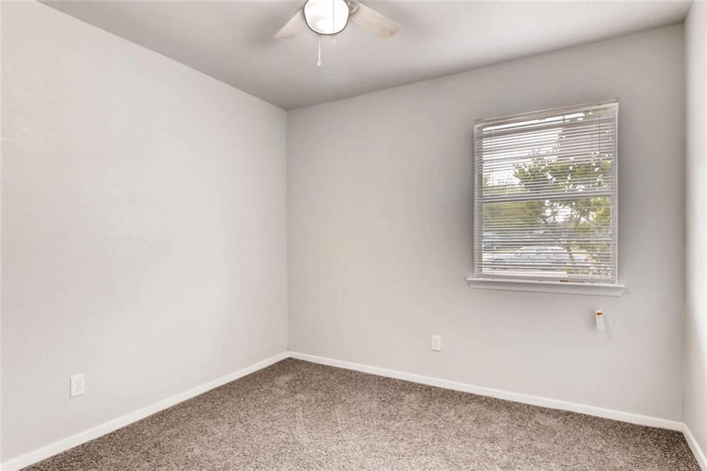 4903 Church Street Greenville, TX 75401 - Photo 4 of 10 an empty room with a window