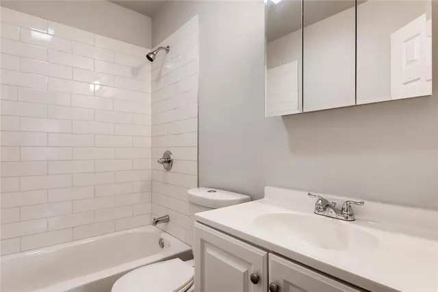 a bathroom with a bathtub and a sink