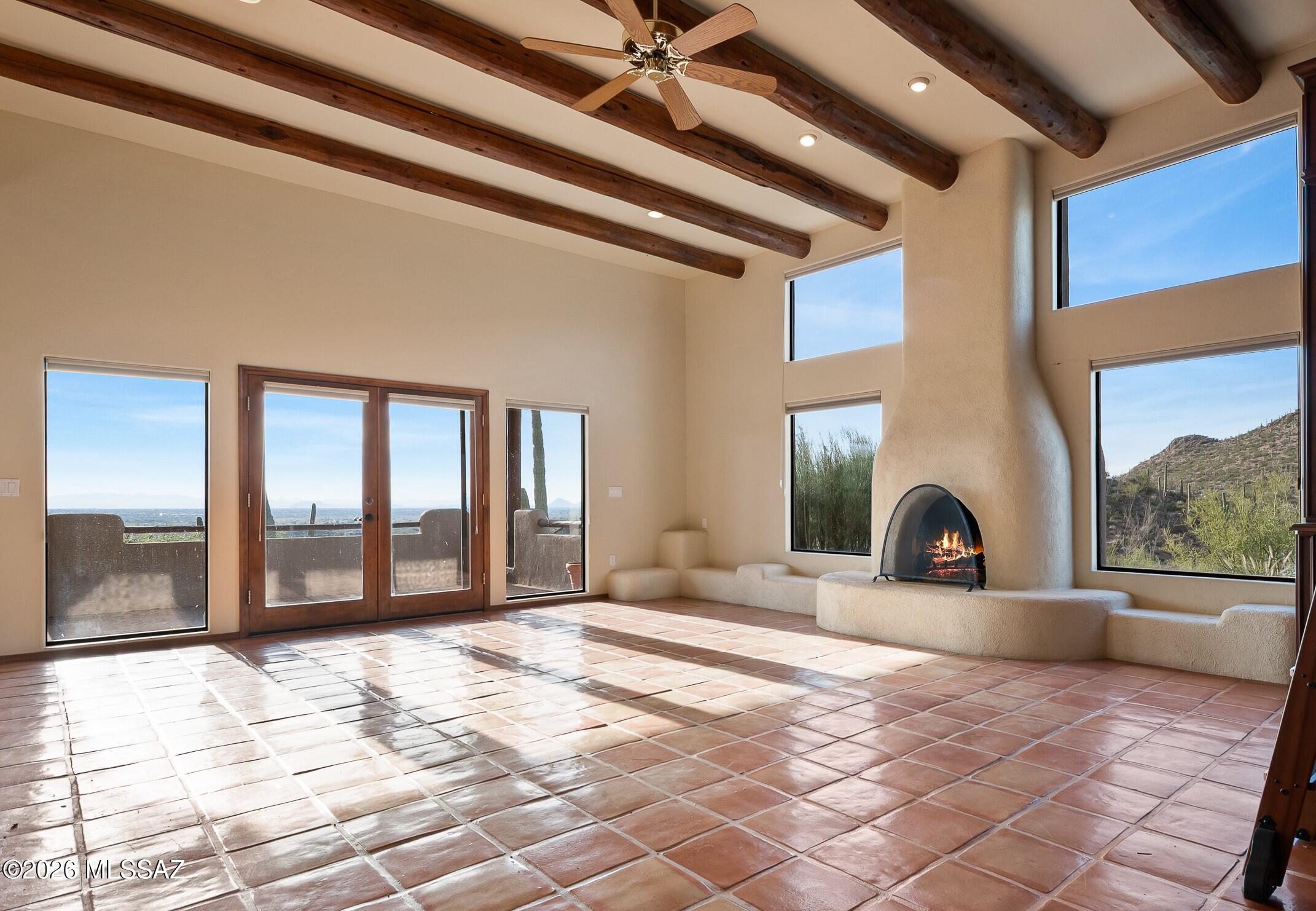 13630 East Sahuaro Sunset Road Tucson, AZ 85749 - Photo 3 of 47 a view of a livingroom with a patio and a garden