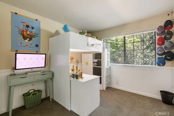 a kitchen with a sink a stove and cabinets