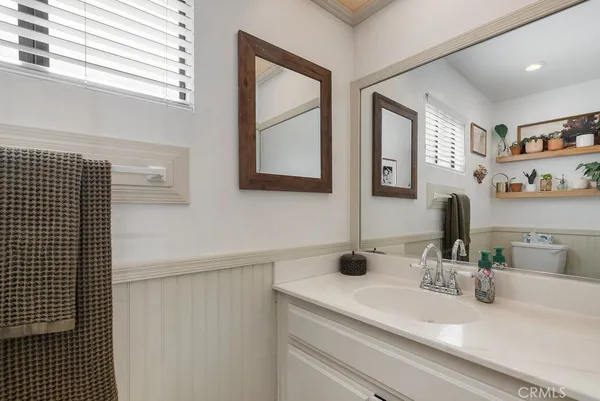 a bathroom with a toilet and a sink