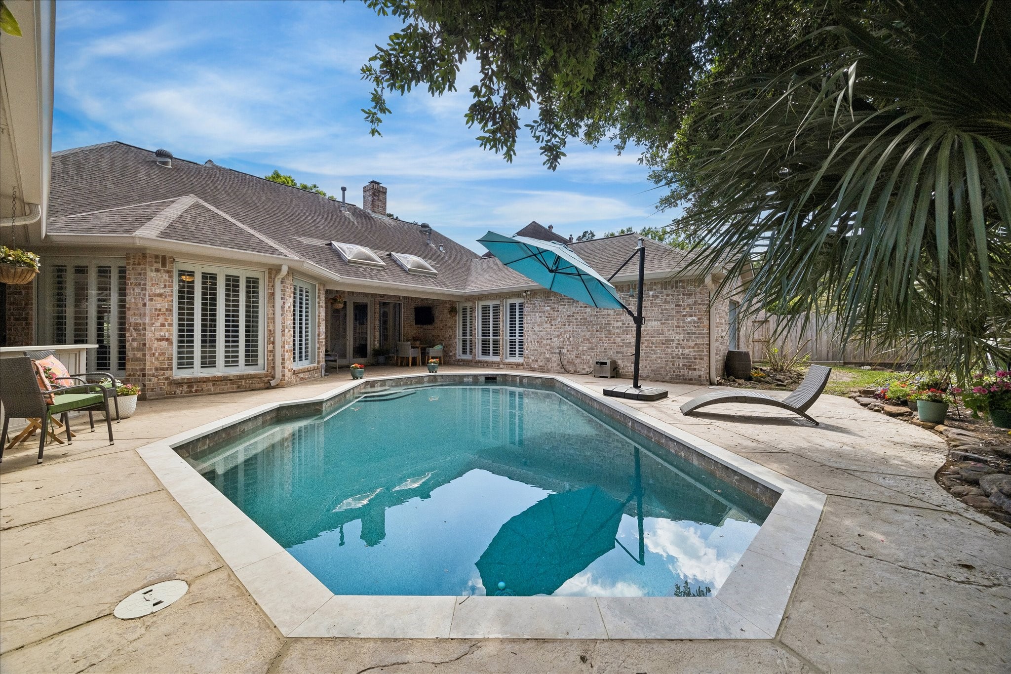 2810 Timber Country Way Kingwood, TX 77345 - Photo 5 of 30 a view of a house with swimming pool and sitting area