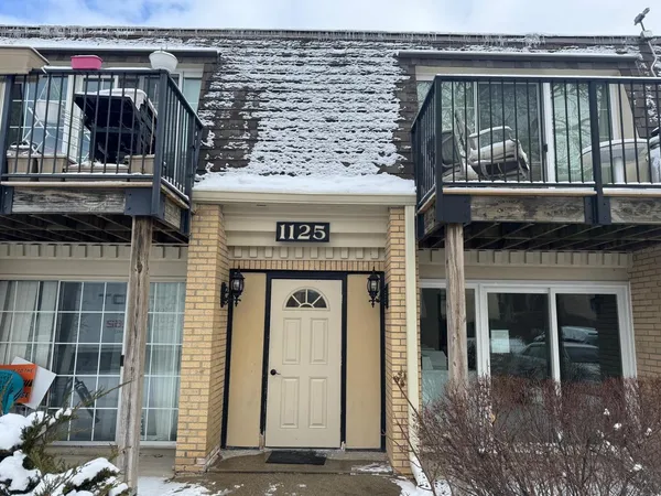 a front view of a house with glass windows