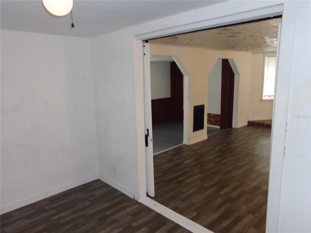 2878 Northeast 161st Street Citra, FL 32113 - Photo 13 of 38 a view of a hallway with wooden floor and entryway